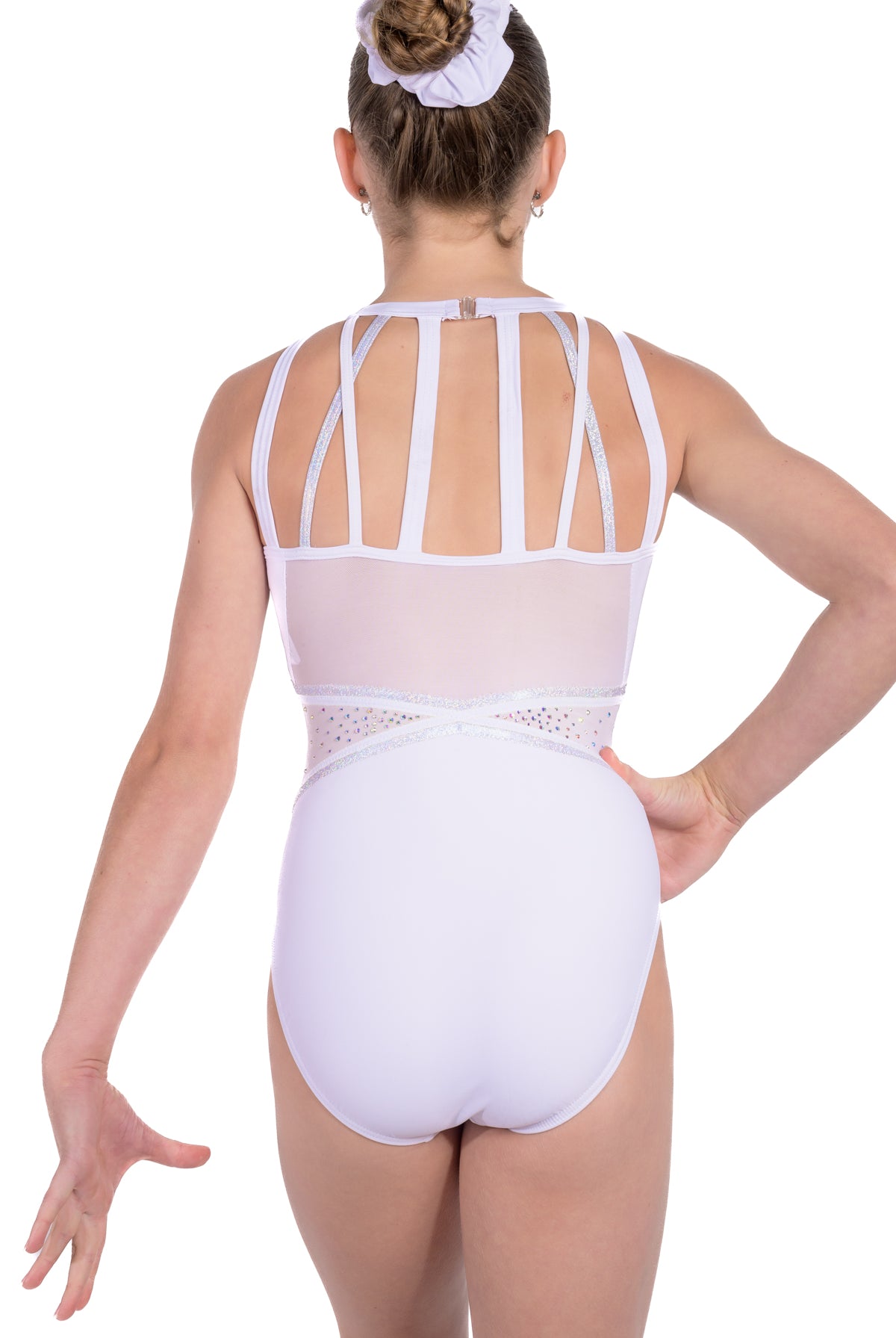 White and silver gymnastics leotard. Soft white lycra and fully lined, shimmering silver rhinestone detailing. Strappy back design with a secure clasp closure, mesh back panel.